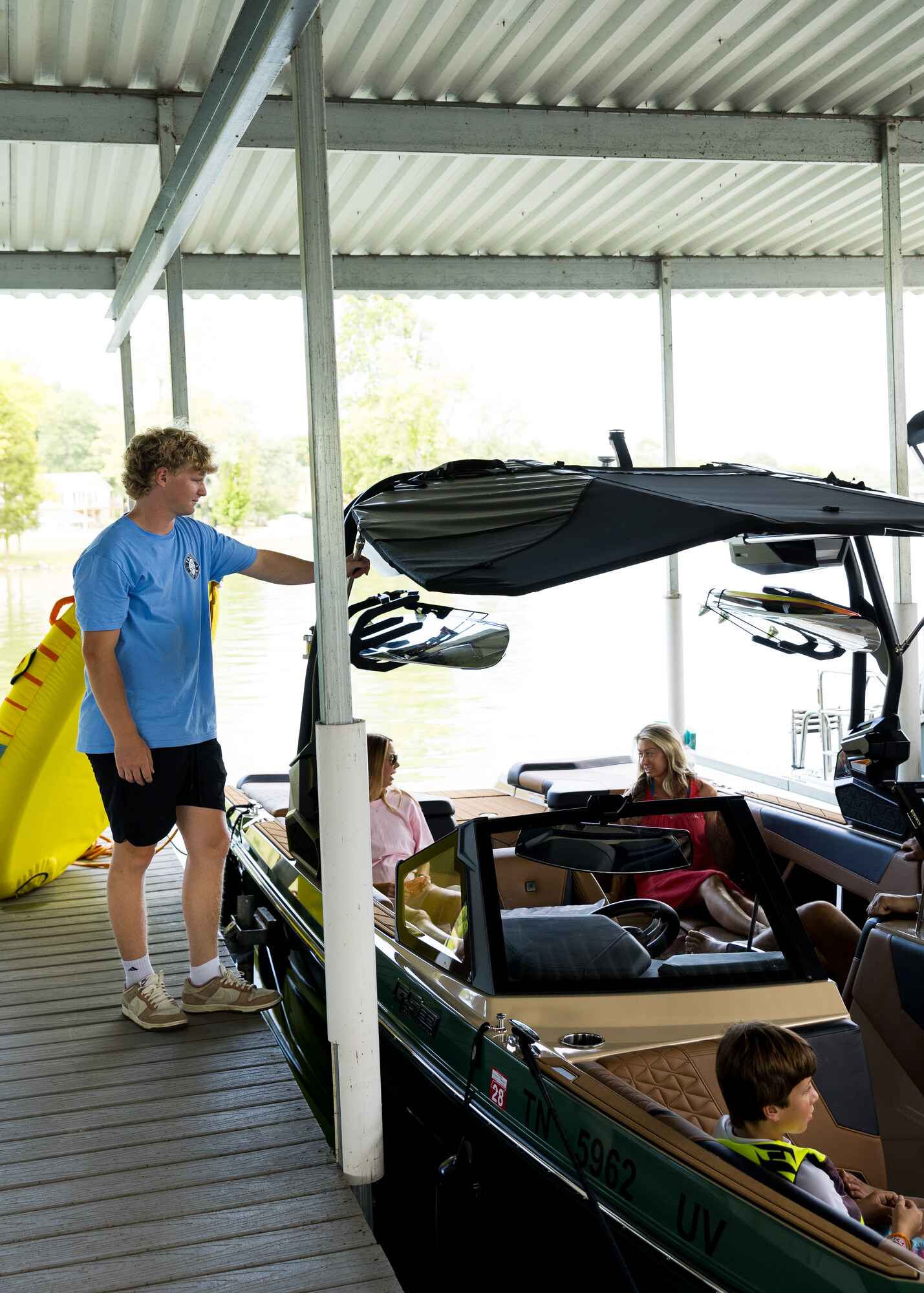 A dock team member preparing a Tennessee club boat