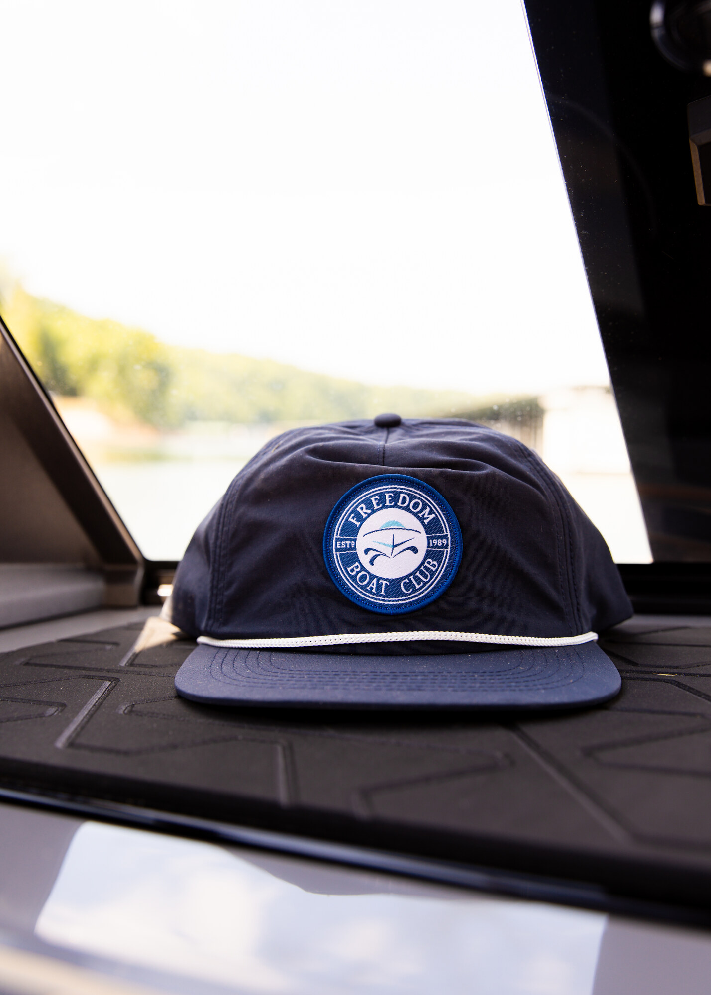 A Freedom Boat Club cap resting aboard a prepared boat